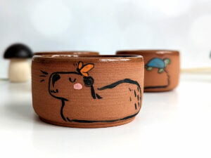 tumbler capybara and friend