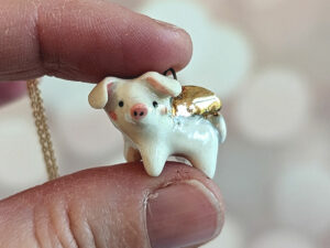 winged piglet pendant