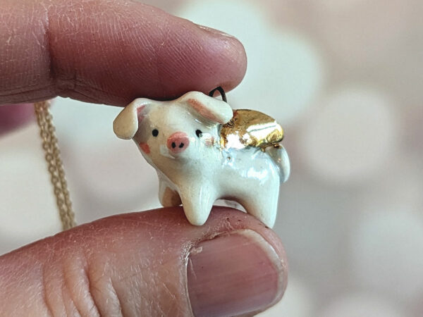 winged piglet pendant