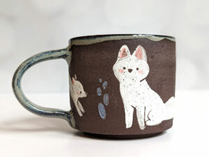 black mug white foxes