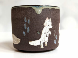 black mug white foxes