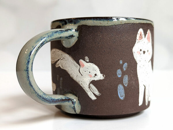 black mug white foxes