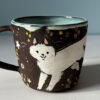 black mug white foxes