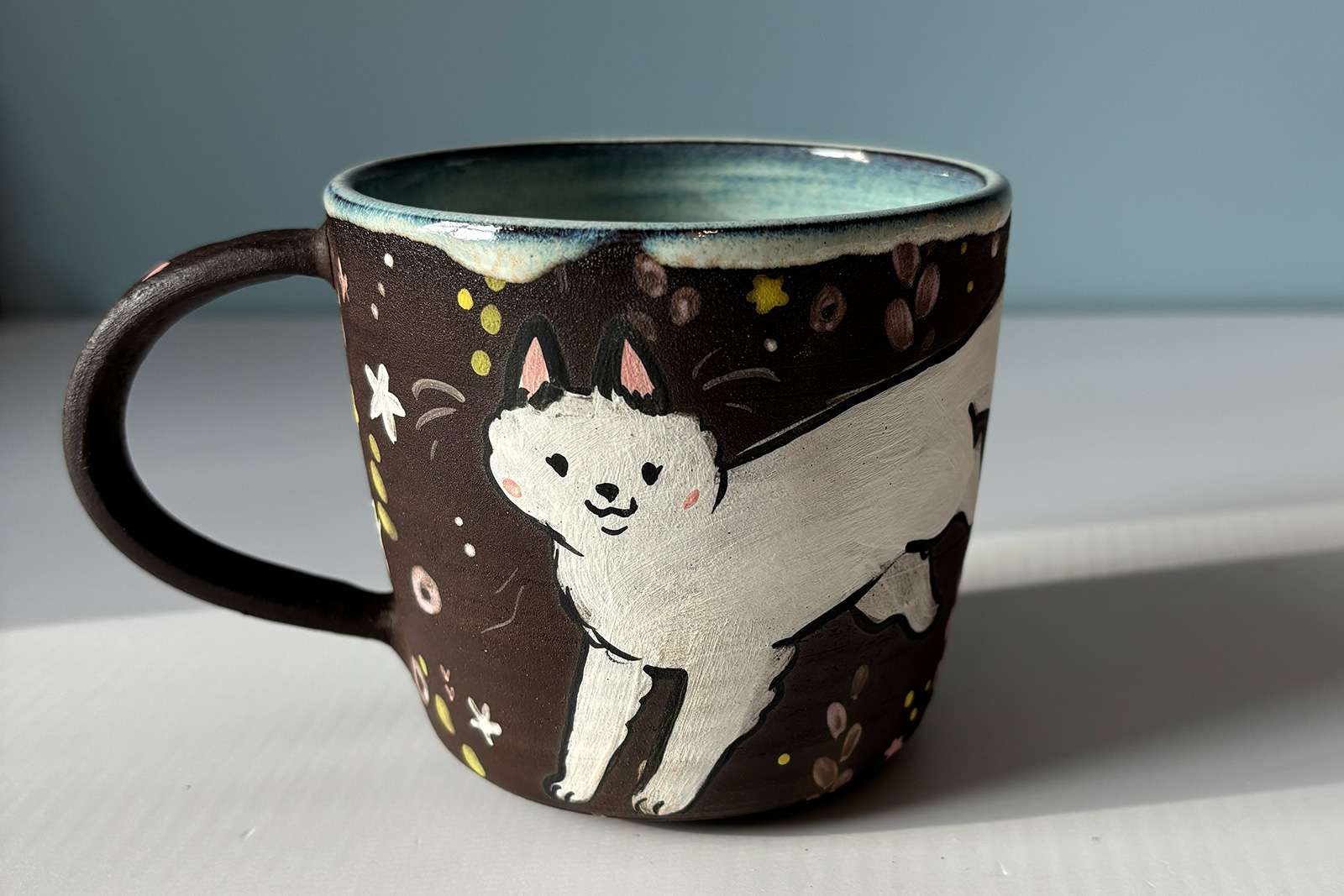black mug white foxes