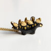 shiny black stegosaurus pendant with gold