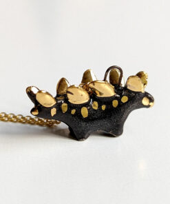 shiny black stegosaurus pendant with gold