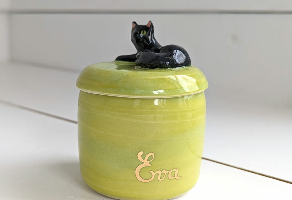 Eva's green urn matches her eyes 