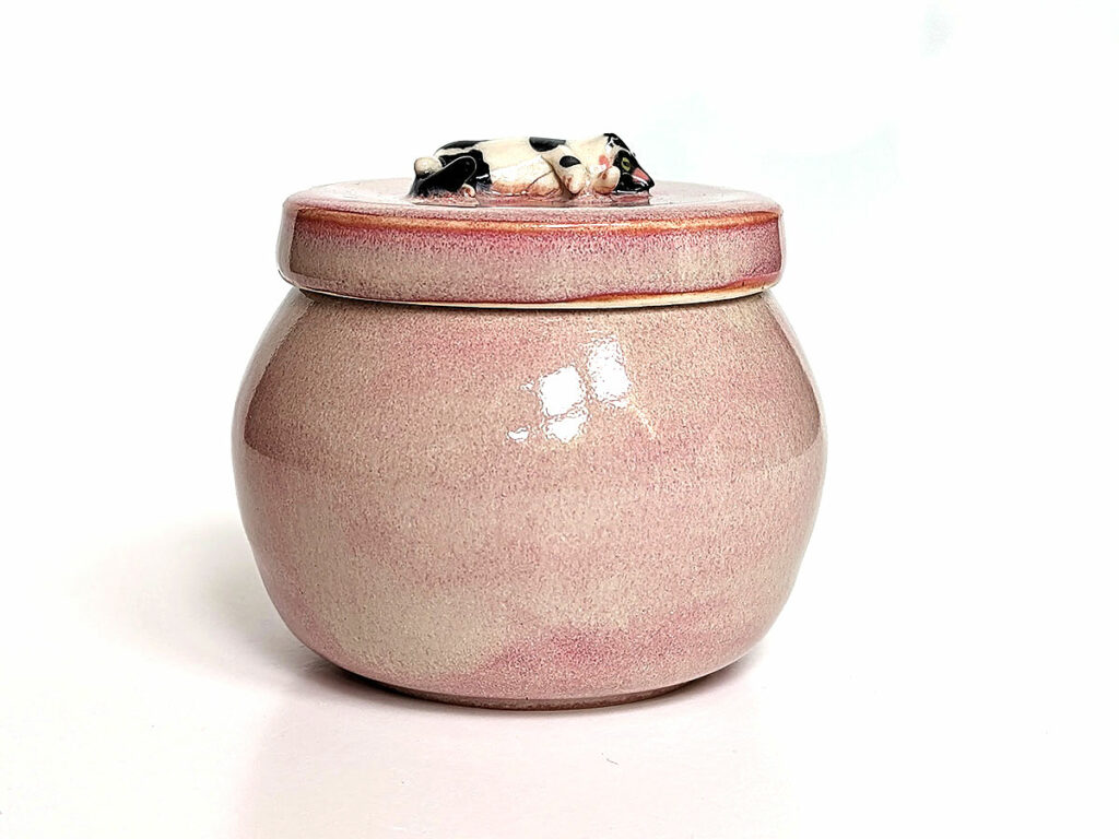 pink urn for a tux kitty