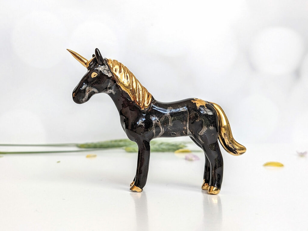 Night and gold unicorn figurine 