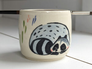 handmade stoneware artist cup for painting raccoons