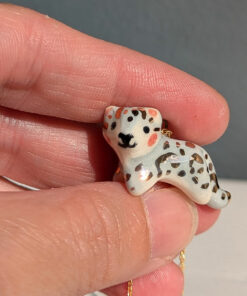 tiny snow leopard pendant