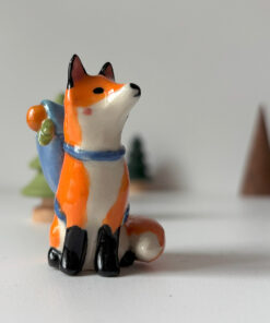 adorable fox figurine with a backpack, handmade porcelain sculpture