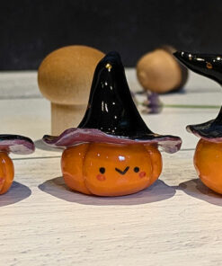 pumpkin witch figurine