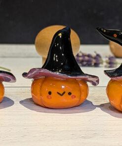 cute pottery by kness pumpkin witch figurine