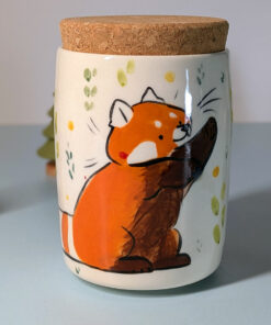 lidded vessel for loose leaf tea or ground coffee, illustrated with a red panda