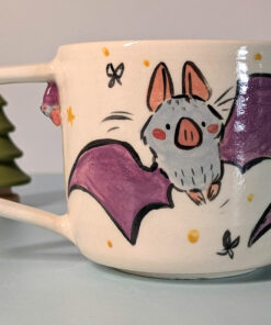 cute little bat mug with a tiny bat sculpted under the handle