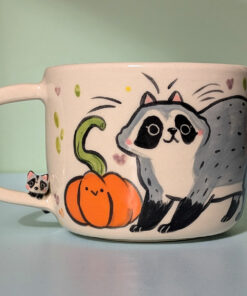 handmade pumpkin and raccoon mug
