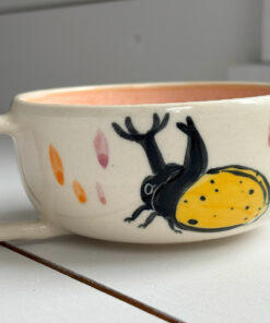 tea cup yellow beetle