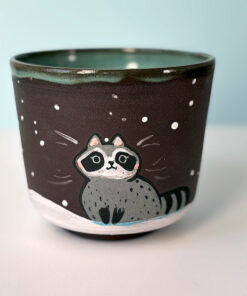 big black cup with a cute raccoon