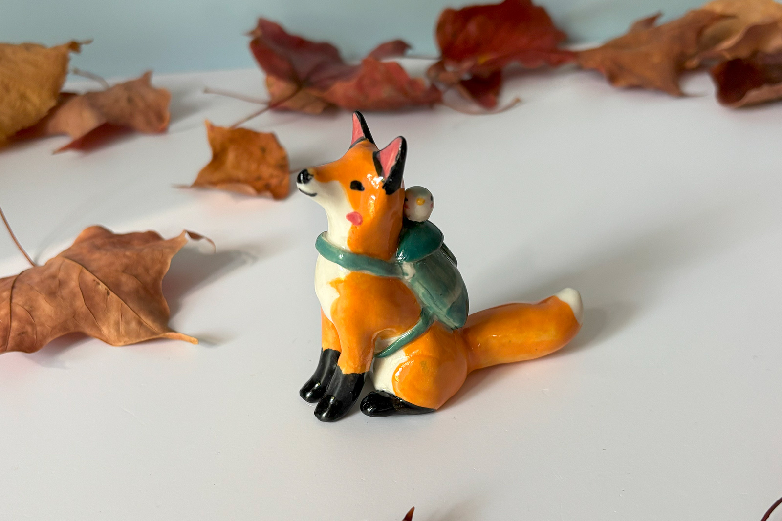 Figurine - Hiking Red Fox With a Passenger