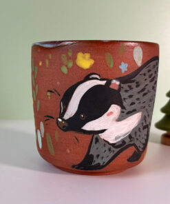 pretty red stoneware cup illustrated with a cute badger handmade in Canada