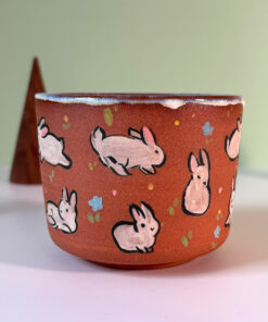 red stoneware cup fluffle of bunnies