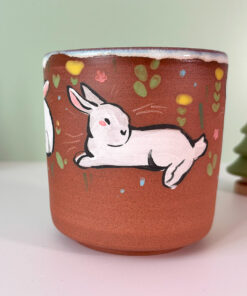 cute red stoneware cup with white bunnies