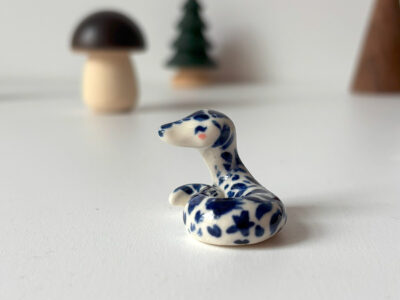 tatooed snake figurine