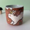 cute cup with a bat winged jackalope