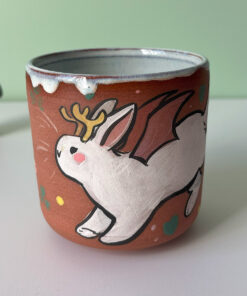 cute cup with a bat winged jackalope