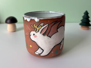 cute cup with a bat winged jackalope