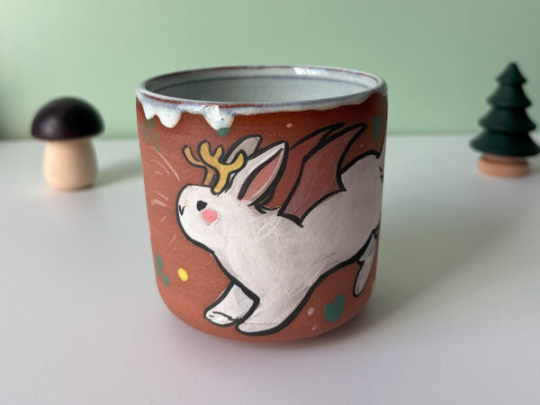 cute cup with a bat winged jackalope