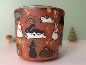 cup too many bunnies in red clay